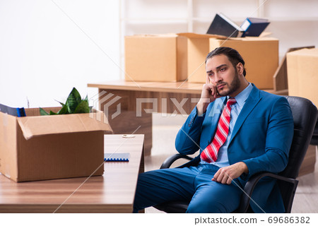Young male employee in relocation concept 69686382