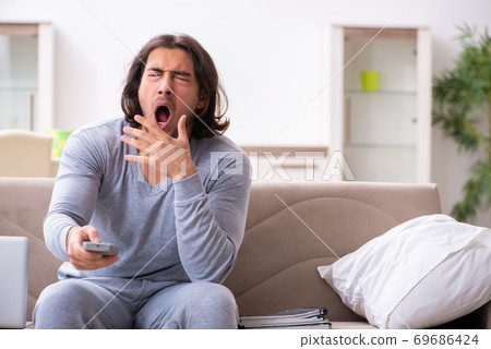 Young male employee freelancer working from home 69686424