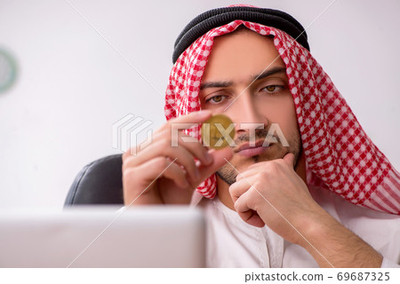 Young male arab employee working in the office Young male arab employee working in the office 69687325