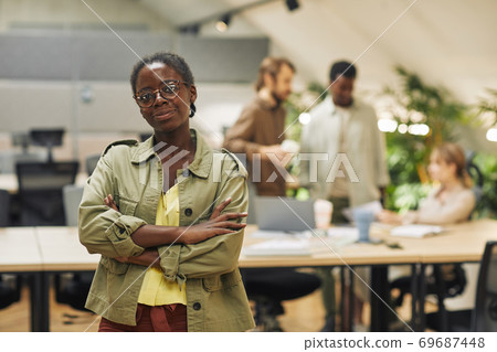 Young African-American Woman Posing Confidently in Office 69687448