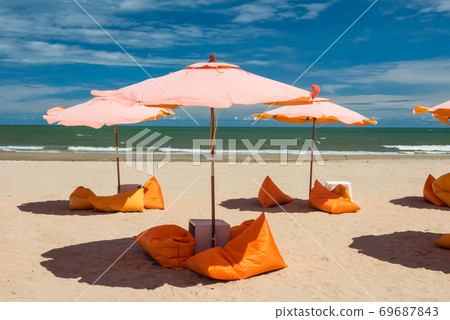 summer beach with orange relax seat and parasol summer beach with orange relax seat and parasol 69687843