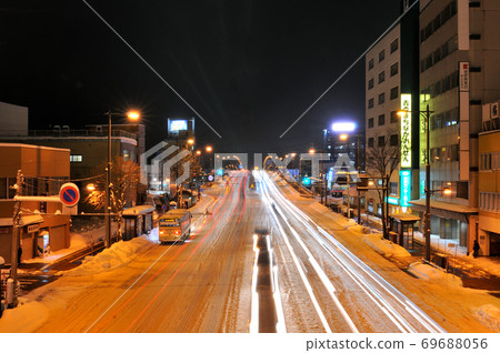 Night view of Route 7 on a heavy snowy day in Aomori City ② 69688056