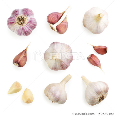 Set of garlic whole, half and cloves on a white background, isolated. Top view Set of garlic whole, half and cloves on a white background, isolated. Top view 69689468