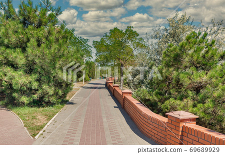 Park alley in Chornomorsk, Ukraine. 69689929