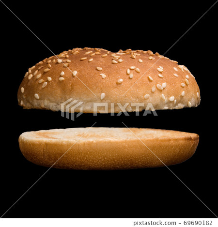 Burger bun isolated on black background Burger bun isolated on black background 69690182