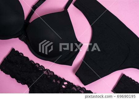 Women's underwear on a pink background. Black lace. Flat lay, view from above. 69690195
