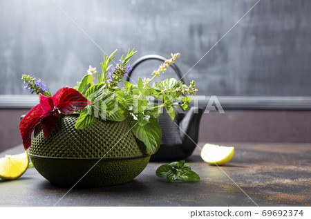 teapot and herb 69692374