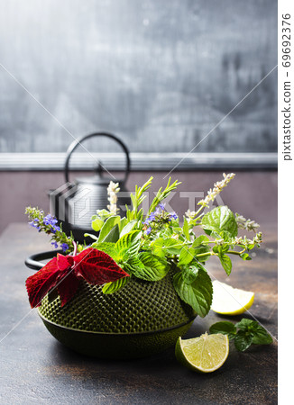 teapot and herb 69692376