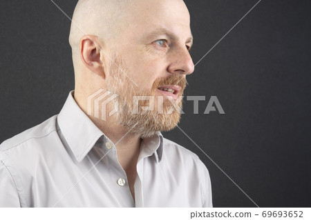 Portrait of a bald and bearded happy man Portrait of a bald and bearded happy man 69693652