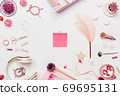 Woman workspace flat lay with paper sheet sticker 69695131
