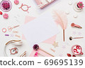 Flat lay desk composition in pastel pink tone 69695139
