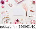 Woman home office desk with blank paper mockup 69695140