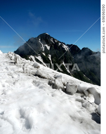 Mt. Tsurugi with snow and fine weather Mt. Tsurugi with snow and fine weather 69696090