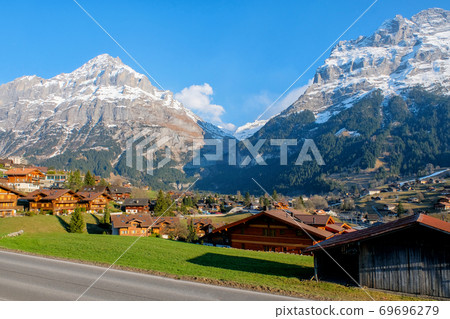 Panoramic view of Grindelwald beautiful village in mountain scenery, Switzerland Panoramic view of Grindelwald beautiful village in mountain scenery, Switzerland 69696279