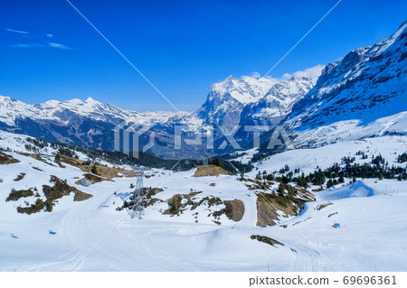Area view from Kleine Scheidegg station, along the railway from Interlaken to Jungfraujoch (3,466 m). In daylight at Switzerland 69696361