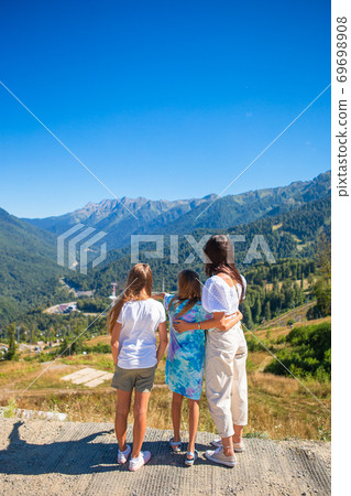 Beautiful happy family in mountains in the background of fog. Beautful landscape 69698908