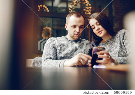 Couple in a cafe Couple in a cafe 69699199