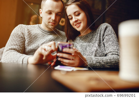 Couple in a cafe Couple in a cafe 69699201