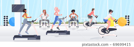 people doing physical exercises on training apparatus fitness workout healthy lifestyle concept 69699415