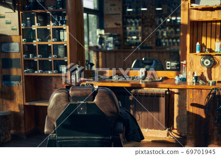 Empty armchair at a workplace of a qualified barber Empty armchair at a workplace of a qualified barber 69701945