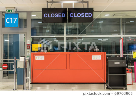 Empty control counter at gate in terminal. Stand of staff at the departure gate at the airport. Empty control counter at gate in terminal. Stand of staff at the departure gate at the airport. 69703905