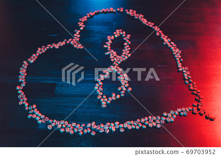 Valentine's Day concept, polyamory symbol heart and infinity sign in the middle. coffee beans. Valentine's Day concept, polyamory symbol heart and infinity sign in the middle. coffee beans. 69703952