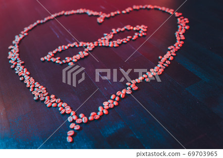 Valentine's Day concept, polyamory symbol heart and infinity sign in the middle. coffee beans. Valentine's Day concept, polyamory symbol heart and infinity sign in the middle. coffee beans. 69703965