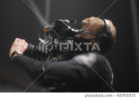 cameraman on the set of the ultimate fighting show. 69705075