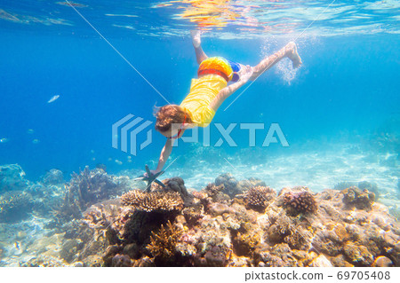 Child snorkeling. Kids underwater. Beach and sea. Child snorkeling. Kids underwater. Beach and sea. 69705408