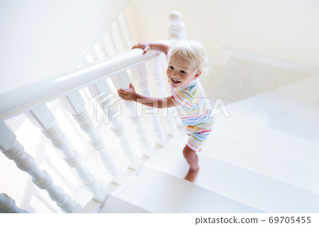 Kids on stairs. Child moving into new home. Kids on stairs. Child moving into new home. 69705455