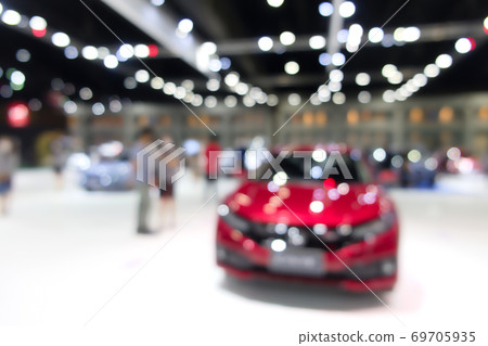 Blurred background of people attending in motor show exhibition event Blurred background of people attending in motor show exhibition event 69705935