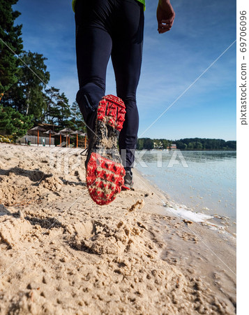 Morning condition workout on beach. Silhouette run 69706096