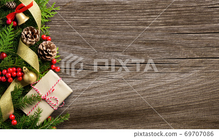 Christmas border composition made of fir branches, cones and gift box 69707086