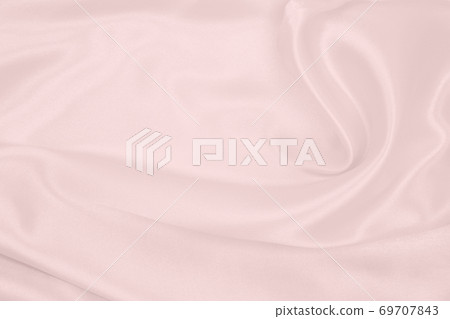 Smooth elegant pink silk or satin texture as wedding background. Luxurious background design Smooth elegant pink silk or satin texture as wedding background. Luxurious background design 69707843