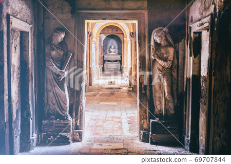 cemetery corridor background with two statues in a vintage camera film effect look cemetery corridor background with two statues in a vintage camera film effect look 69707844