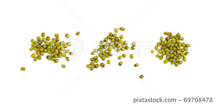 Dry raw mung beans or vigna radiata seeds isolated on white Dry raw mung beans or vigna radiata seeds isolated on white 69708478