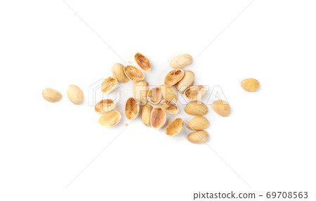 Pile of pistachios husks isolated on white background 69708563