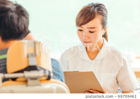 Nurse and patient 69709461