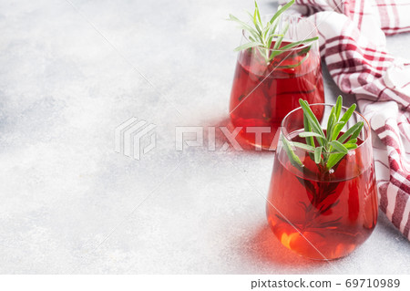 Drink from the berries of red viburnum in glass Cup. Berry compote with vitamin C against the common cold. Copy space. 69710989
