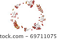 Beautiful autumnal rowanberries with autumn-coloured leaves put together in a circle 69711075