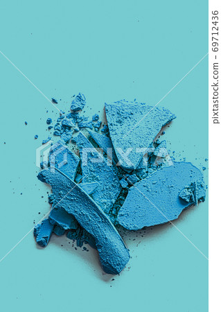 Blue eye shadow powder as makeup palette closeup, crushed cosmetics and beauty texture Blue eye shadow powder as makeup palette closeup, crushed cosmetics and beauty texture 69712436