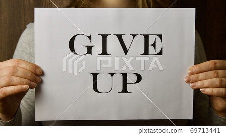 A paper that says " give up " when making the necessary decision A paper that says " give up " when making the necessary decision 69713441