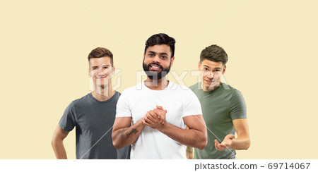 Group portrait of emotional people on yellow studio background Group portrait of emotional people on yellow studio background 69714067