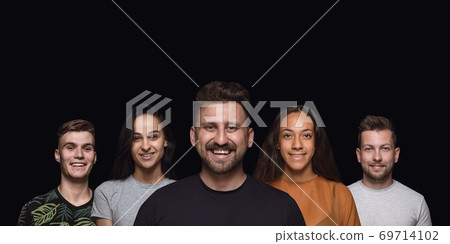 Group portrait of emotional people on black studio background Group portrait of emotional people on black studio background 69714102
