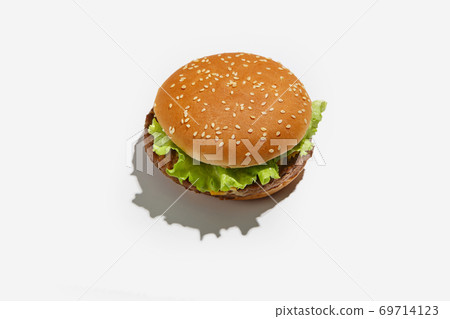 Delicious and quick lunch with fast food or home delivery for client during coronavirus pandemic. Yummy hamburger with lettuce 69714123