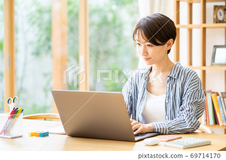 Woman doing telework in the living room 69714170