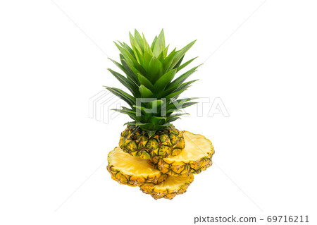 whole pineapple and pineapple slice. Pineapple with leaves isolate on white. 69716211