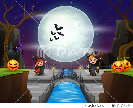 Little witch playing in the Halloween night 69717799