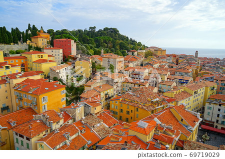 Landscape with tiled roofs in southern France 69719029