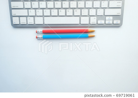 top view of keyboard and color pencils on white background top view of keyboard and color pencils on white background 69719061